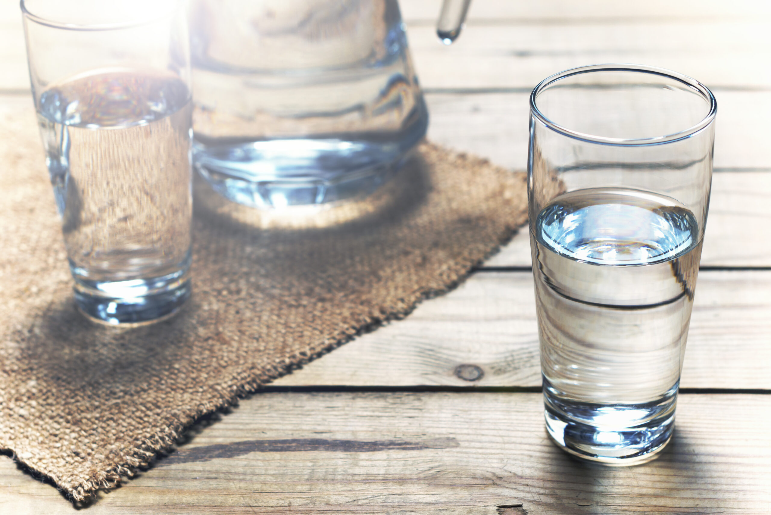 Glasses,Of,Water,On,A,Wooden,Table.,Selective,Focus.,Shallow